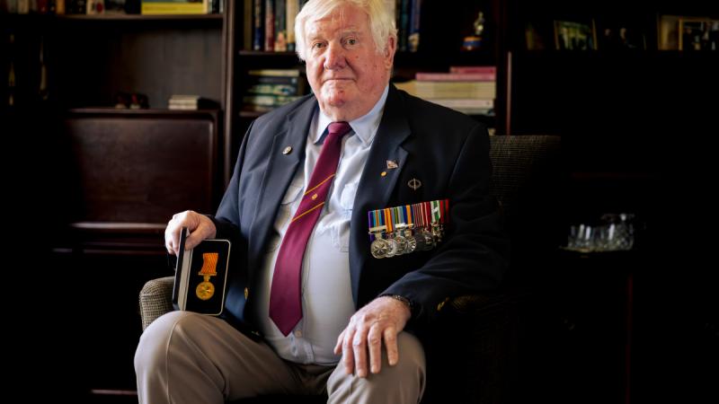 Major Mark Moloney with his Medal for Gallantry.