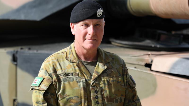 Australian Army officer Captain Robert Cussion with the M1A1 Main battle tank at RAAF Base Edinburgh, South Australia.