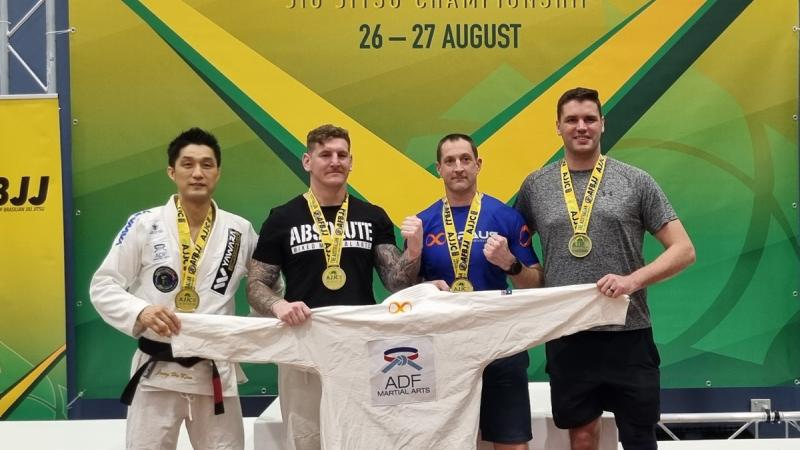 Private Jung Kim, Captain Dylan Voncina and Corporal Anthony Zambory after their division wins and Captain Ian Thompson with a bronze medal at the 2023 Australian Brazilian Jiu-Jitsu Championships.