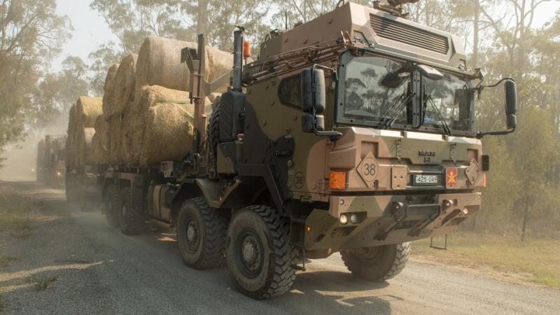 Australian Army HX77 heavy rigid vehicles loaded with fodder heading for Bonang in the north of Gippsland in support of Operation Bushfire Assist, 2020.