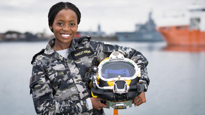 Gap Year Seaman Vimbayi Hakutangwi with a dive helmet at HMAS Stirling, Western Australia.