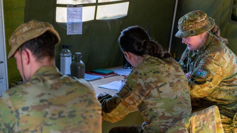 Third year trainee officers Samuel Woods, Matilda Roberts and Emily Lewis during the ADFA Leadership Challenge Three exercise in Majura training field in Canberra.