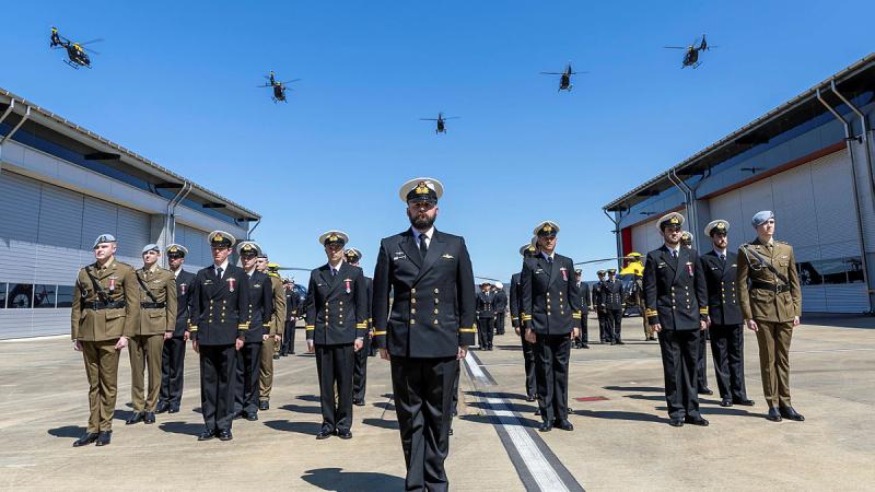 Five EC-135 helicopters conduct a fly past on completion of the Joint Helicopter School Course 012 graduation ceremony at 723 Squadron, HMAS Albatross. Photo: Petty Officer Justin Brown