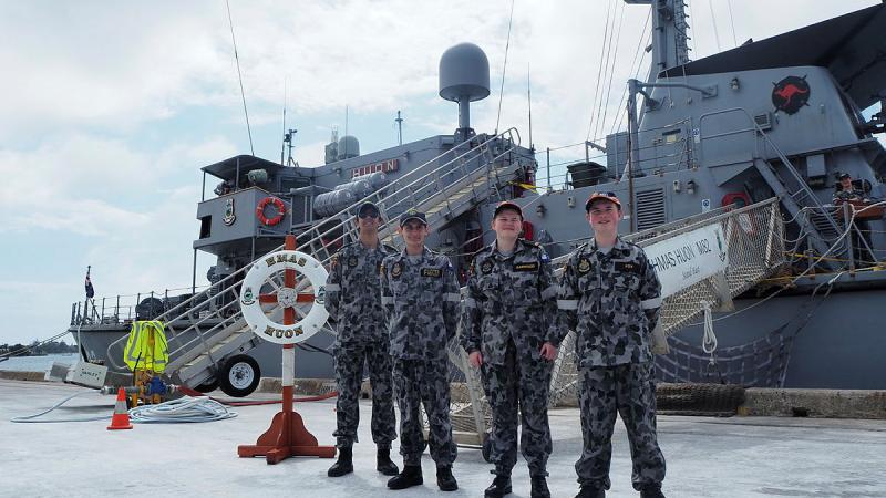 Australian Navy Cadets stand by HMAS Huon.