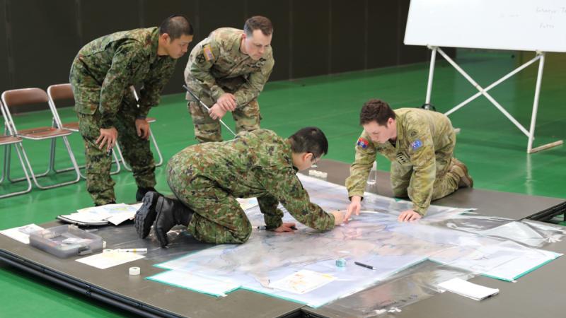 Linguist Captain Harry Brick clarifies a point during planning for Exercise Yama Sakura with his Japanese and US counterparts at Camp Higashi-Chitose, Hokkaido Japan