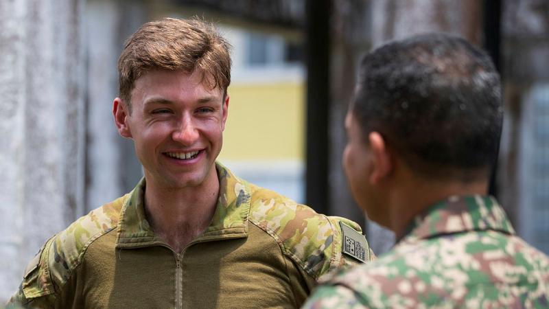 Australian Army Platoon Commander Lieutenant John Haycroft converses with Malaysian Armed Forces Major Hazwan.