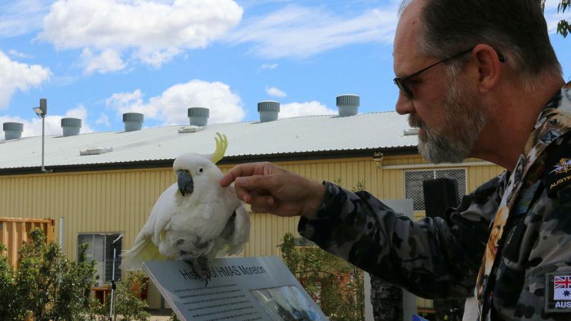 Chaplain Stephen Briggs with Bob the 54-year-old cockatoo at HMAS Moreton’s Blessing of the Pets.