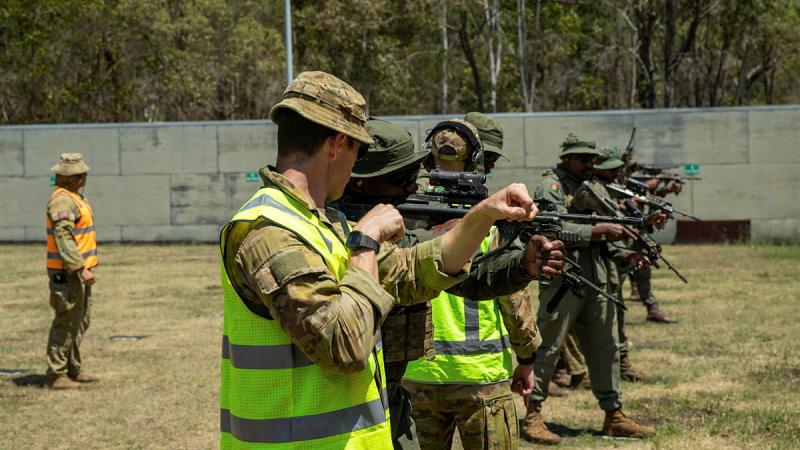 Australian Army soldiers instruct Republic of Fiji Military Forces members during a live shoot with the Australian EF88, as part of Exercise Coral Warrior at Gallipoli Barracks, Brisbane.