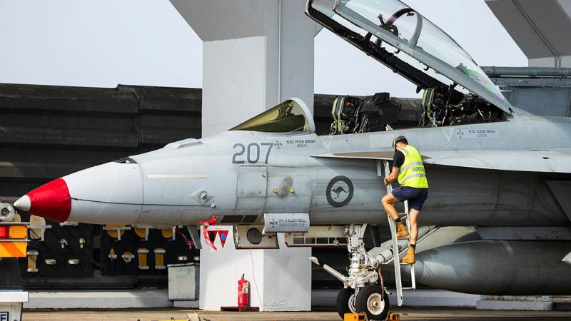 RAAF aviator finalises a systems check of a F/A-18F Super Hornet at RMAF Butterworth during Exercise Bersama Lima, Malaysia.
