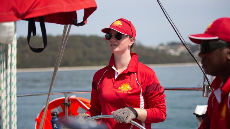 An Army member navigates Army's sailing training yacht 'Gun Runner' during Exercise Soldier Sail in Port Stephens, New South Wales.