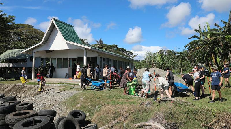 Members of the Solomons' International Assistance Force work with Alligator Creek community to repair coastal erosion at the Seventh Day Adventist Church, Alligator Creek, Solomon Islands. 