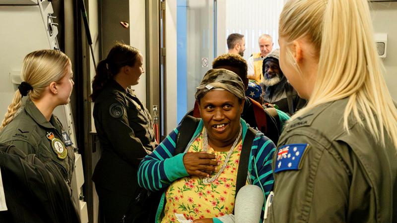 The crew of a RAAF KC-30A welcome passengers on board at Ben Gurion Airport, Tel Aviv, before conducting an assisted-departure flight to Dubai. Photos: Corporal Robert Whitmore
