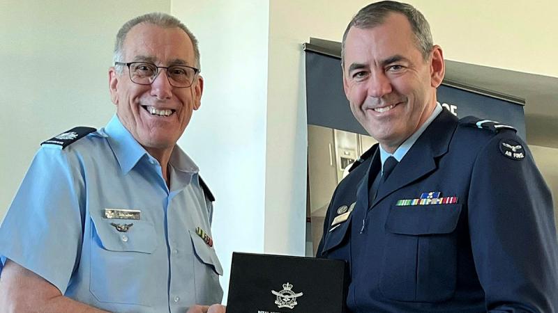 Warrant Officer Don Kenny (L) is presented with his Defence Long Service Medal, sixth bar (2nd Federation Star), by Air Commodore James Badgery, Chief of Staff Air Force Headquarters.