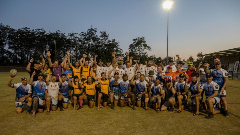 The Royal Australian Corps of Signals & Spartans Rugby Club members and supporters gather in celebration of breaking the Guinness World Record for the longest marathon playing touch/mini/tag rugby game.