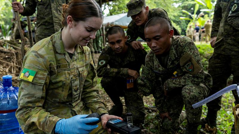 Australian Army Environmental Health Technician, Corporal Edie Haley tests a water sample for heavy metals and minerals after being filtered during water purification and desalination training, Fort Magsaysay, Philippines. 