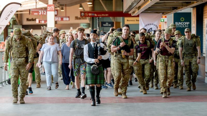 A piper leads the participants at the start of the 8th annual 42 for 42 event at Suncorp Stadium in Brisbane. 