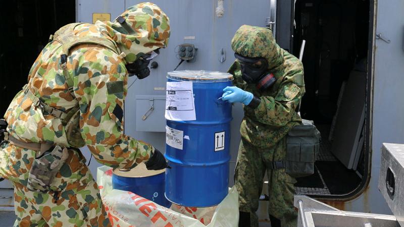 Australian and Singaporean defence personnel conduct CBRN training on board HMAS Brisbane whilst alongside in Sembawang. 