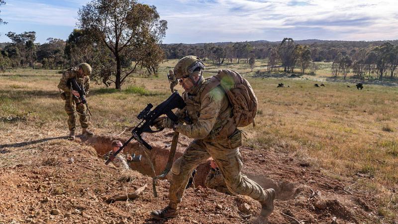 Australian Army soldiers from the 22nd Engineer Regiment guard an enemy player during Exercise Platypus Survives at Puckapunyal Military Training Area. 