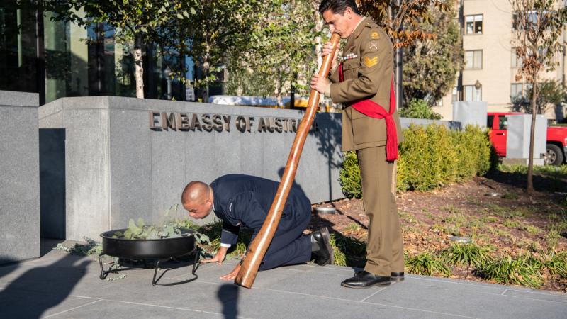 Australian Army soldier Sergeant Lachlan Youll plays the didgeridoo at the opening of the The Australian Embassy in Washington DC.