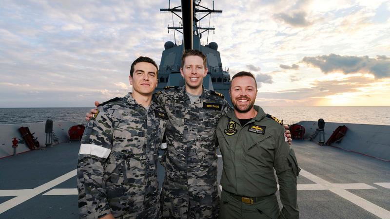 From left, Able Seaman Hayden Beaver, Lieutenant Ben Page and Lieutenant Commander Matthew Urquhart on the forecastle of HMAS Brisbane during Annualex 2023. 