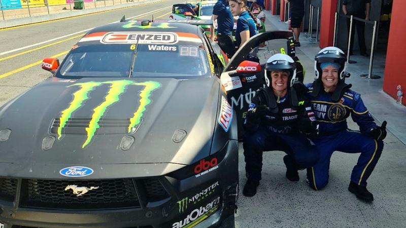 Petty Officer Boatswain Jenna Shiel and Leading Seaman Military Chef Amanda Bourke receive a V8 Super Car hot lap in recognition of their service for their voluntary support of the veteran community. 