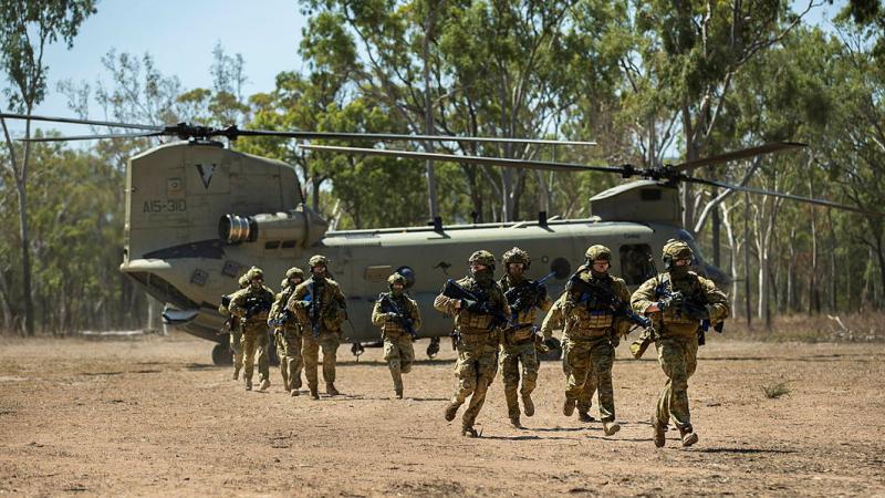 Australian Army soldiers from 1st Battalion, The Royal Australian Regiment disembark a CH-47 Chinook during Exercise Green Blaze at Townsville Field Training Area. 