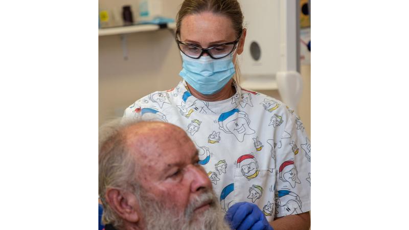Air Force dental assistant Sergeant Deborah Williamson from 2 Expeditionary Health Squadron prepares Clyde Russ for a dental procedure during Exercise Kummundoo in Derby, WA. 