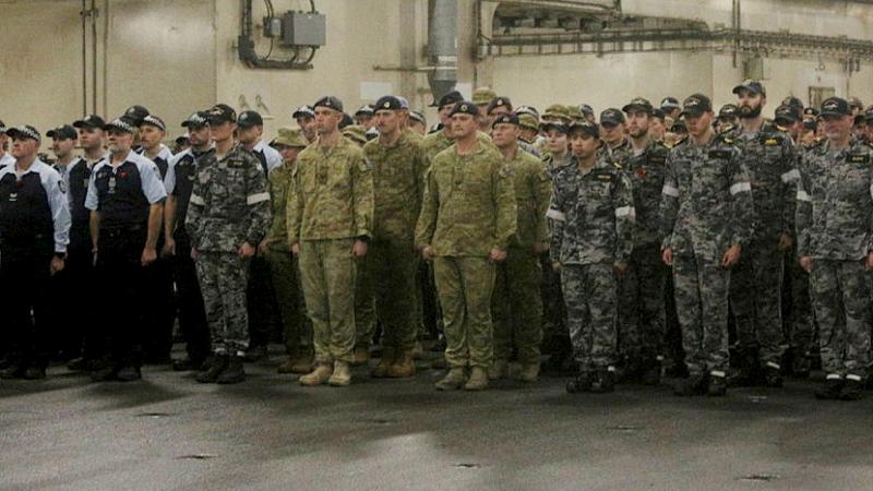 Ship's company, along with Australian Army and Australian Federal Police personnel, mark Remembrance Day on board HMAS Choules.  