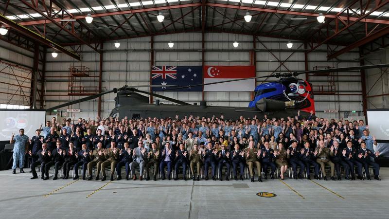 Personnel from the Australian Army, Republic of Singapore Air Force and guests at the celebrations for the RSAF Silver Jubilee Oakey Detachment at Queensland. 