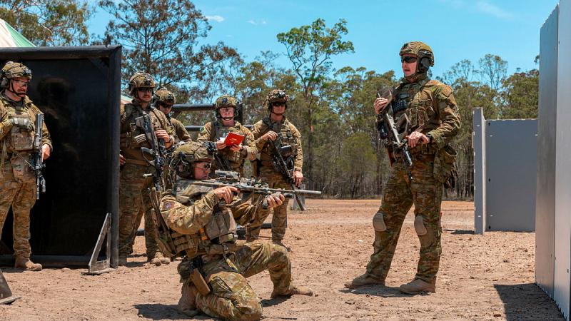 Riflemen from the 6th and 8th/9th Battalions, The Royal Australian Regiment run through target engagements during Urban Operation User course at Greenbank Training Area, Queensland.