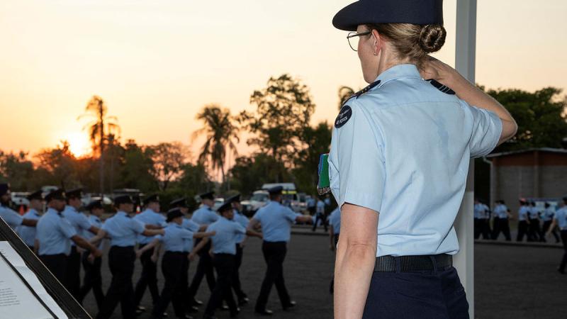 Incoming Commanding Officer 13 Squadron Wing Commander Lauren Guest, takes the salute during the handover parade at RAAF Base Darwin. 