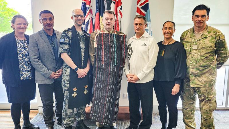 New Zealand Defence Force and Joint Movements Officer posted to HQJOC Warrant Officer Class 1 Robert ‘Jobie’ Jobe, third from right, presented a Maori Kaitaka (cloak) to Chief of Joint Operations Lieutenant General Greg Bilton, centre, during a traditional ceremony held at HQJOC.