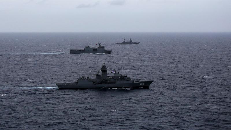 Philippine Navy ships BRP Davao Del Sur, centre, and BRP Gregorio Del Pilar, back, conduct a maritime cooperative activity with HMAS Toowoomba during a regional presence deployment. 