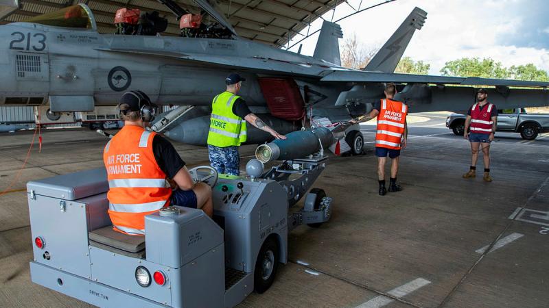 Armament Technicians from 1 Squadron load a GBU-16 on to an F/A-18F Super Hornet at RAAF Base Tindal, during Exercise Crimson Dawn 23-2. 