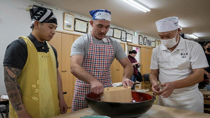 Australian Army soldier Lance Bombardier Lachlan Smith sifts flour during a soba noodle-making class as part of the Exercise Yama Sakura 85 cultural activities in Chitose, Japan. 