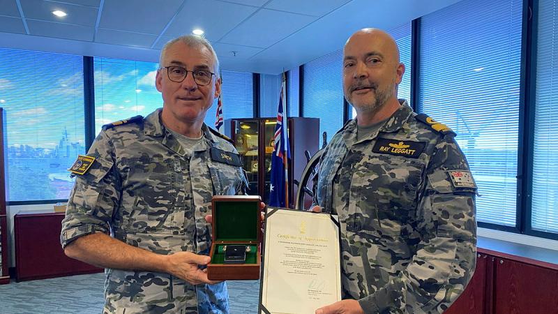  Commander Australian Fleet, Rear Admiral Christopher Smith, left, presents Deputy Fleet Commander, Commodore Ray Leggatt a Federation Star for 40 years' service in the RAN during a ceremony held at Garden Island, NSW. 