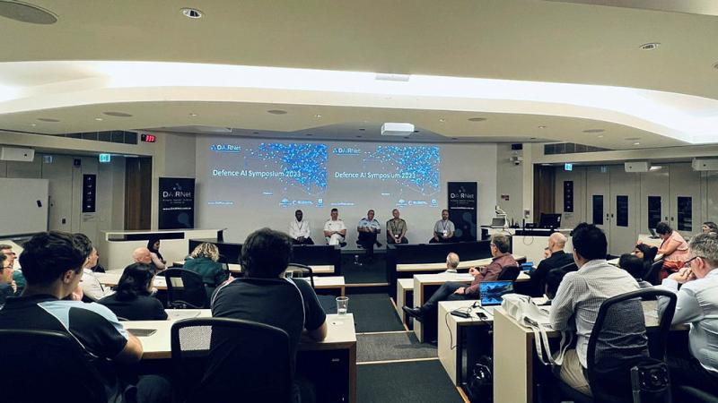 A group of researchers and Defence representatives participate in the DAIRNet Defence Artificial Intelligence symposium. 