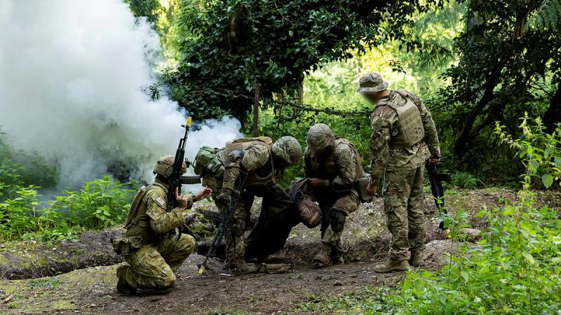 An Australian Army soldier instructs Armed Forces of Ukraine recruits during battle inoculation training.