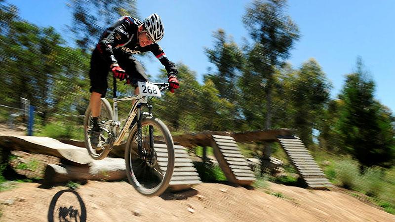 Sergeant Roger Derrick braces for landing during the Super D race at Stromlo Forest Park, Canberra. 