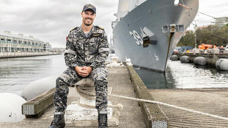 Engineering Officer Lieutenant Parritt in front of HMAS Hobart, Sydney, NSW. 
