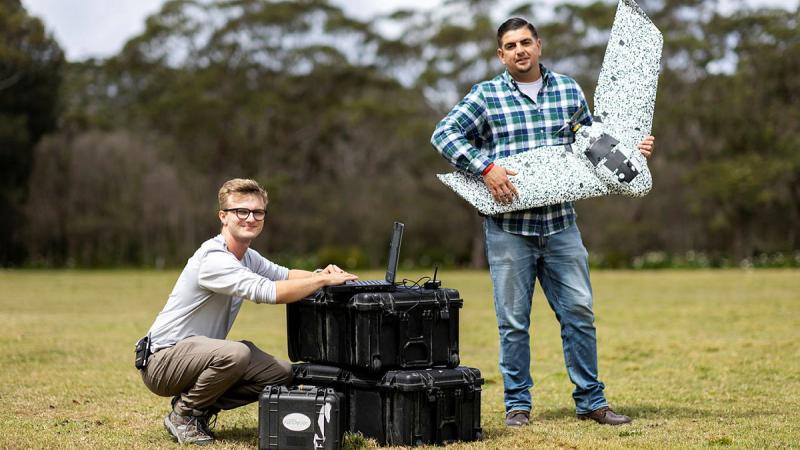 Will Forker and Luis Leal demonstrate the EB-EBEE TAC during the Technical Cooperation Program AI Strategic Challenge 2023 at HMAS Creswell, Jervis Bay Territory. 