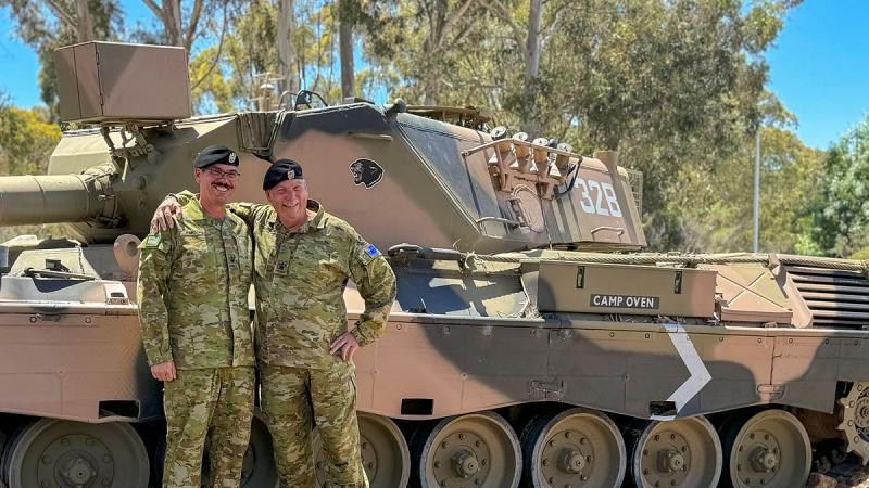 Warrant Officer Class Two William ‘Bob’ Parsons with his son, Warrant Officer Class Two Robert Parsons, outside the Royal Australian Armoured Corps Sergeants Mess at the Puckapunyal Military Area. 