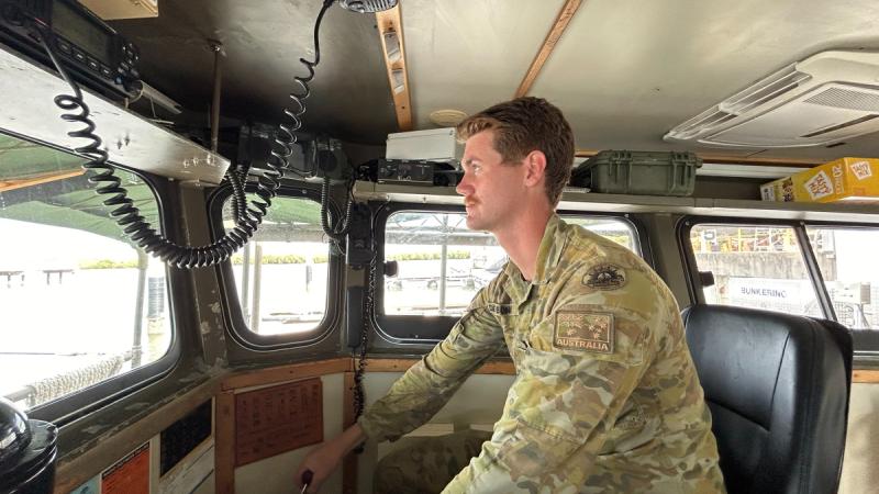 Vessel master Corporal Ridge Debono prepares to depart Townsville aboard Landing Craft "Snoopy" for flood assist tasking in Far North Queensland