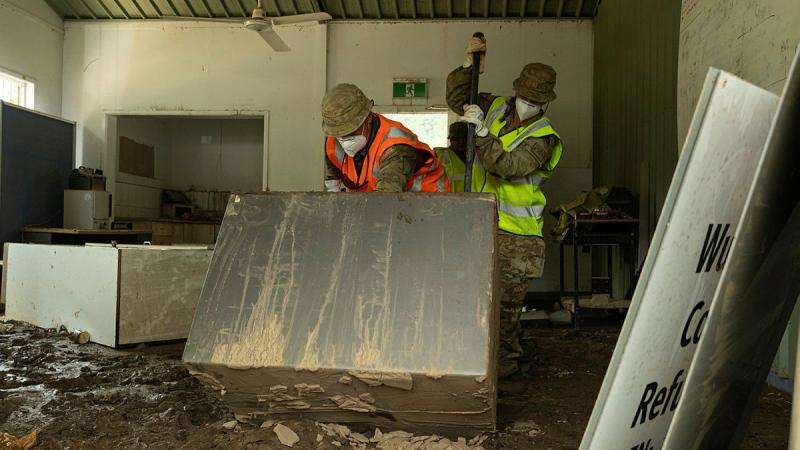 Australian Army soldiers assigned to Joint Task Group 629.3 clean up flood affected buildings in Wujal Wujal, Queensland.