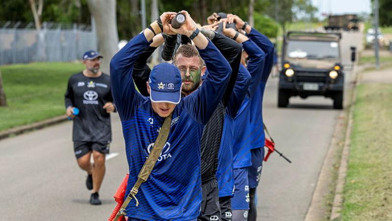 Rope run North Queensland Cowboys players conduct a rope run during their leadership and team-building camp in Queensland.