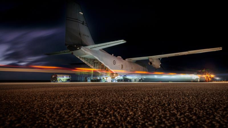 RAAF aviators unload a C-27J Spartan at Andersen Air Force Base, Guam, in readiness for Exercise Cope North 24.