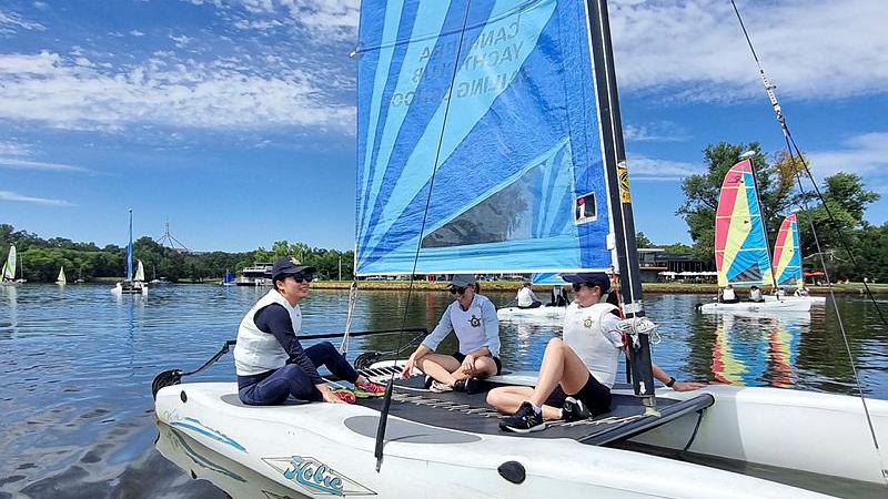 Women aviators aboard a catamaran. 