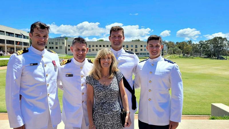 Lieutenant Commander Paul Newton, second from left, with sons, left to right, Jamie, Nick and Liam, and wife Tonia at the 2022 ADFA graduation ceremony, Canberra.