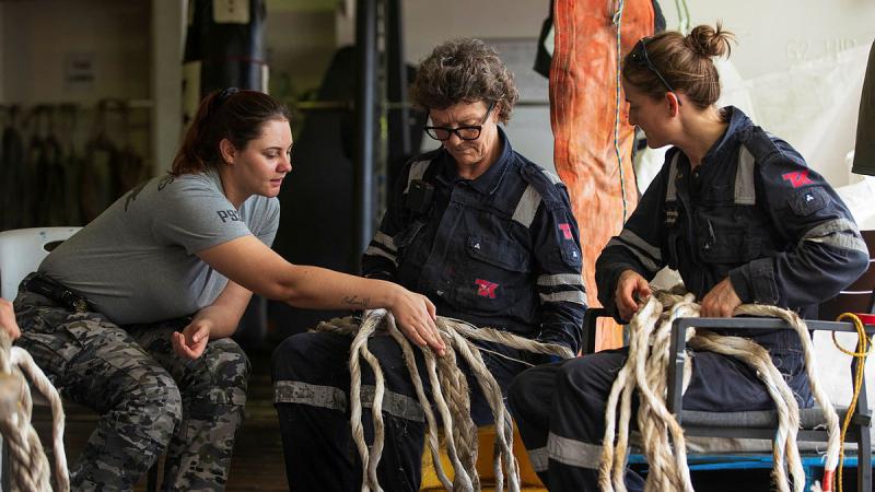 Able Seaman Hannah Moore, left, and ADV Reliant crew members Ann Holmes, centre, and Brooke Saal, right, conduct line splicing during transit to Pohnpei, Federated States of Micronesia. 