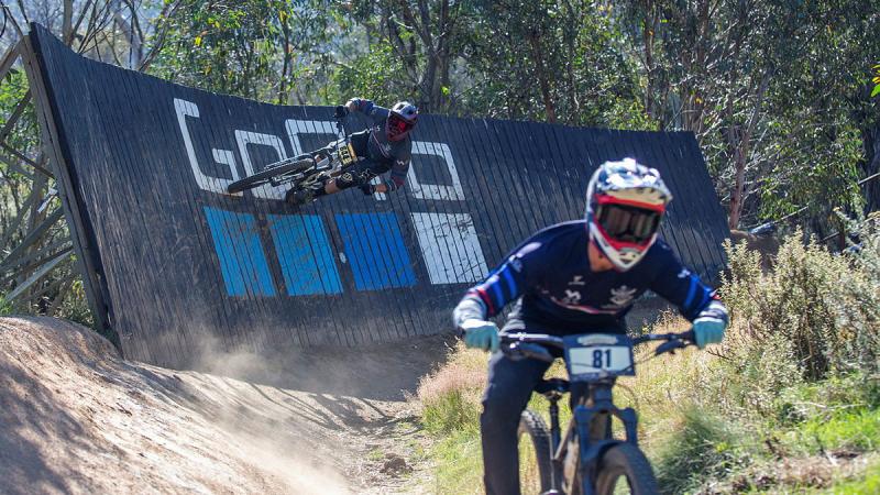ADF cycling president Squadron Leader Aaron Pyle, left, races after Private Jarrod Hughes during the 2024 Cannonball Mountain Biking Festival at Thredbo. 